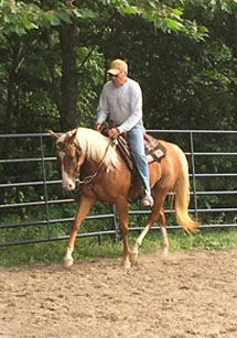 Mike riding a horse